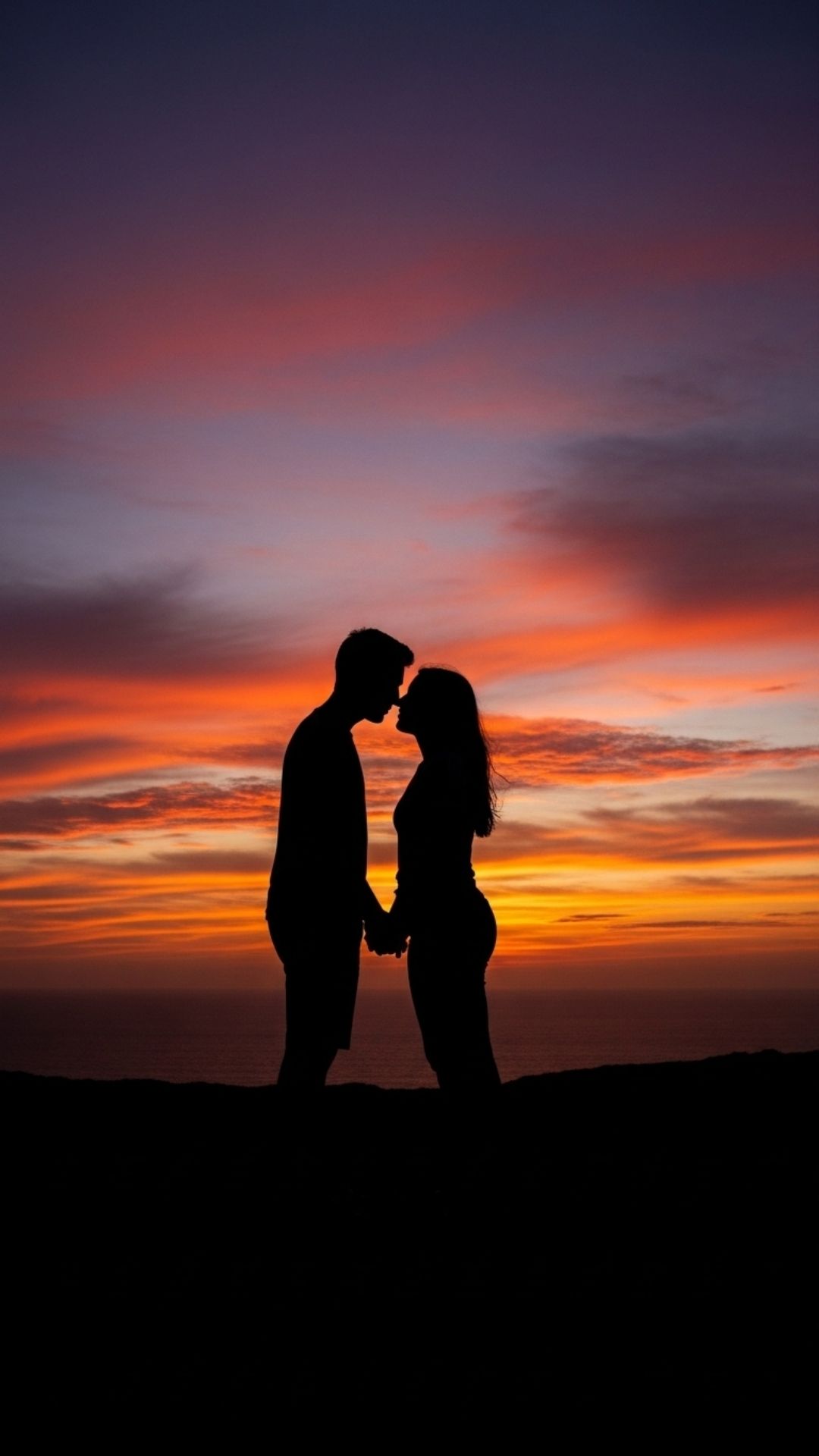 The silhouette of a couple about to kiss against a dramatic sunset sky, a romantic and anonymous Love DP - Stylish Couple DP for Facebook | Majekfilms.com