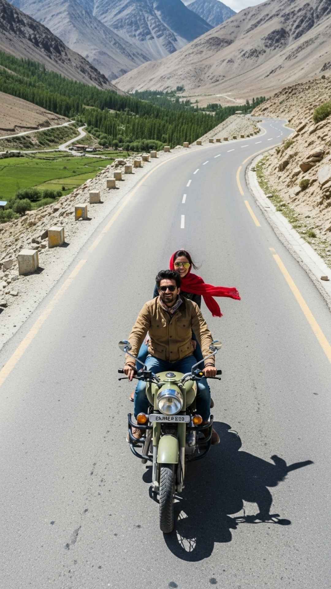 Unique Indian couple riding Royal Enfield overhead view