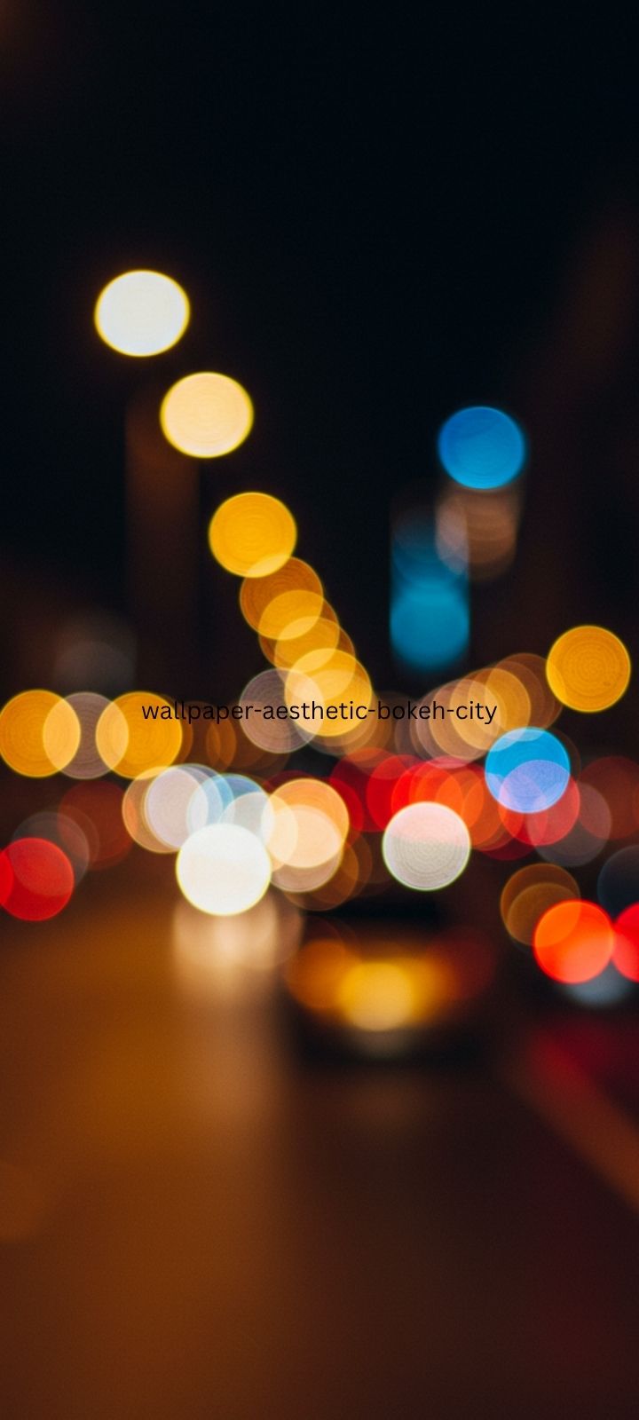 Aesthetic bokeh city lights wallpaper, blurred night background.
