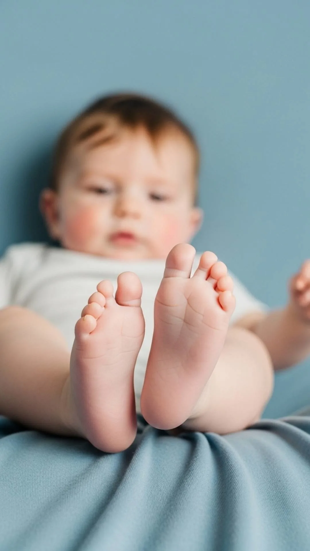 A happy and cute baby boy DP showing playful kicking feet, an energetic and joyful profile picture