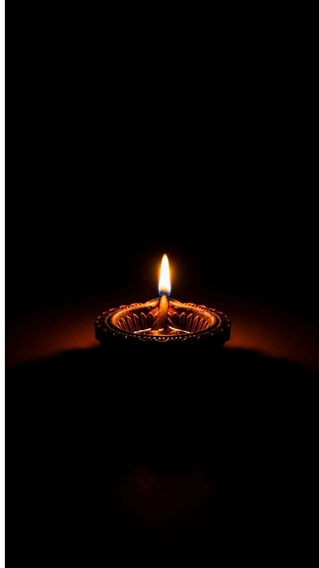 Symbolic black WhatsApp DP with a glowing Diya lamp, representing hope and light, suitable for festive or thoughtful profiles.