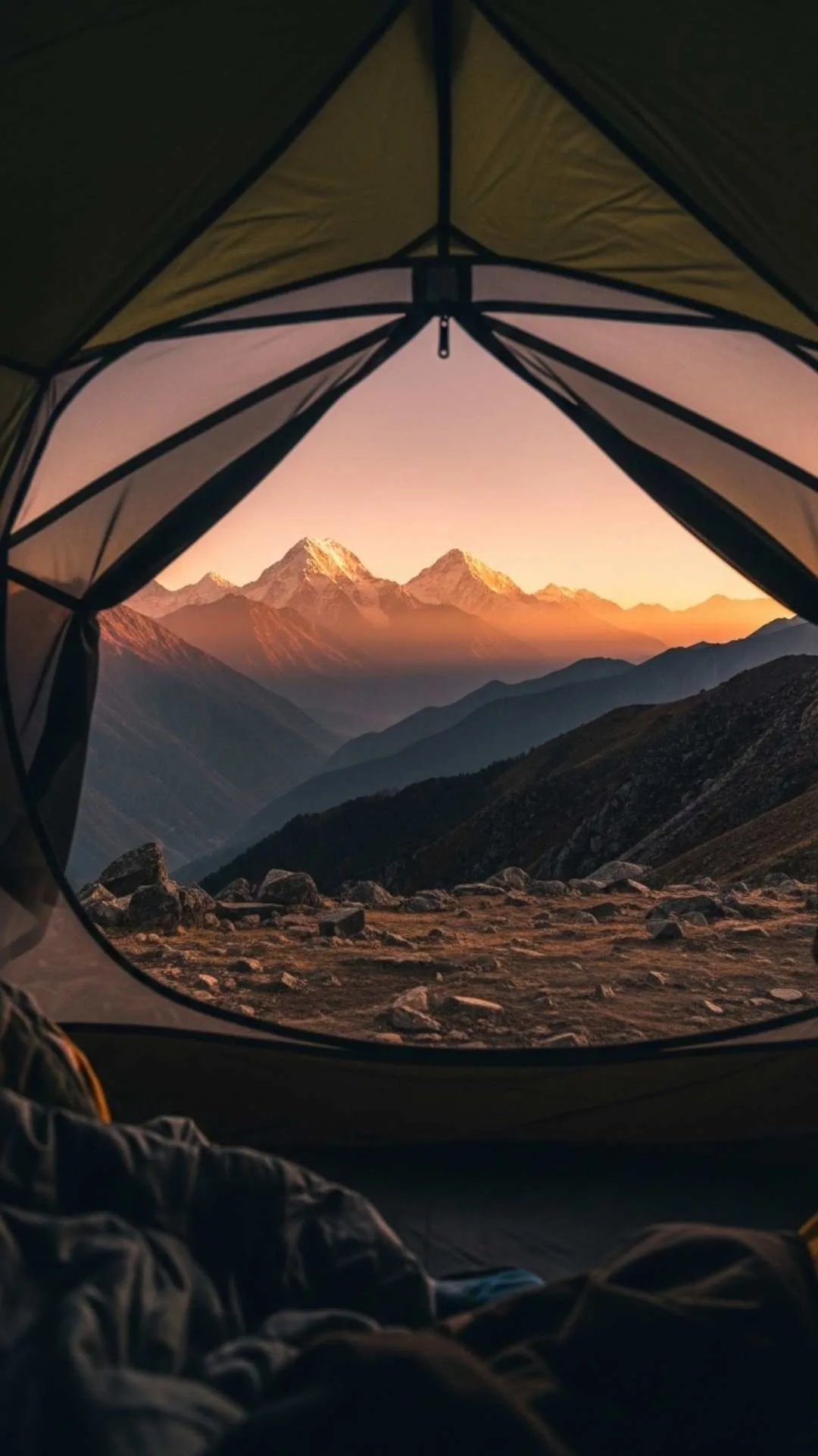 The stunning view of a Himalayan sunrise from inside a camping tent. A life-loving and adventurous DP for campers and explorers