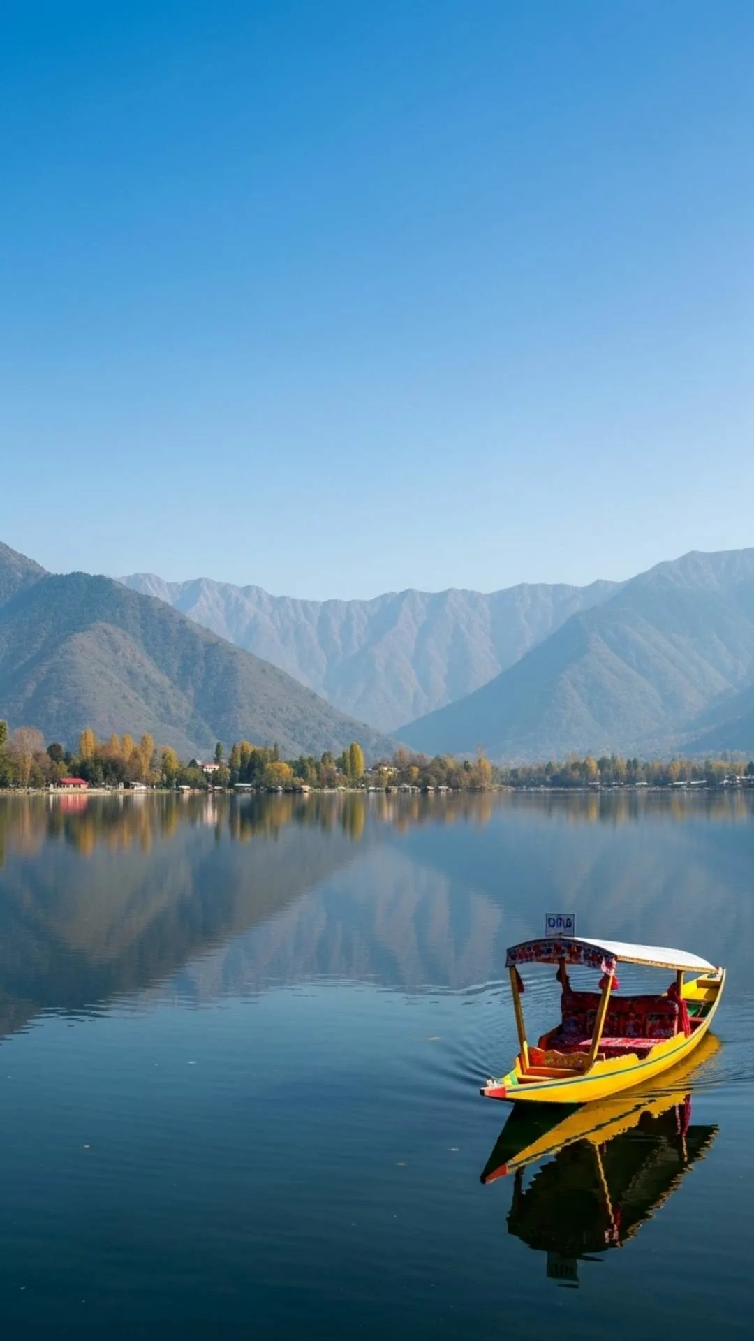 Serene Kashmir lake reflection DP for WhatsApp, with clear water reflecting mountains and sky. A peaceful lake nature profile picture.