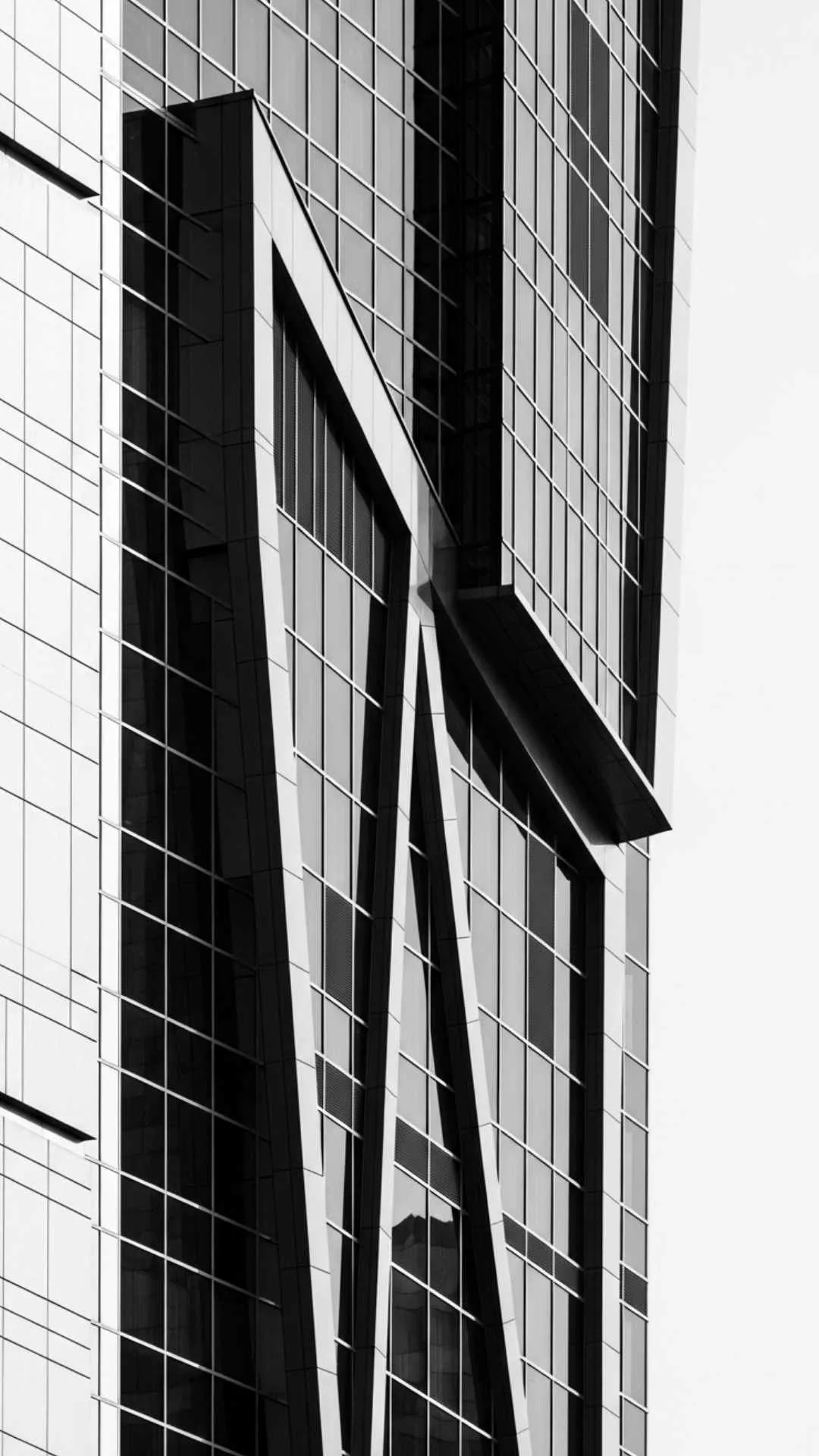 A black and white minimalist DP showing an abstract, geometric pattern from a detail of modern architecture, like a spiral staircase. #ArchitecturalMinimalism #Geometric #BlackAndWhiteDP #LinesAndShadows #Modern